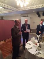 Rotarian Leonard Jacob addresses the members after his election. President Richard and speaker Gareth behind.